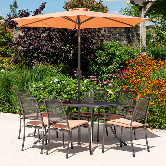 Product photograph of Prats Outdoor Dining Table With 6 Chairs And Parasol In Ochre from Furniture in Fashion
