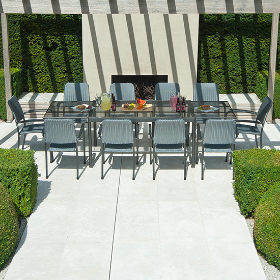 Photo of Prats extending dining table with 10 armchairs in charcoal