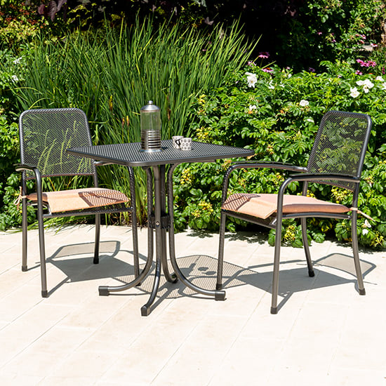 Photo of Prats outdoor square bistro table with 2 armchairs in ochre
