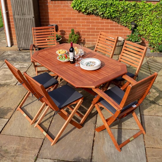 Read more about Putey dining table with 6 grey cushion chairs in factory stain