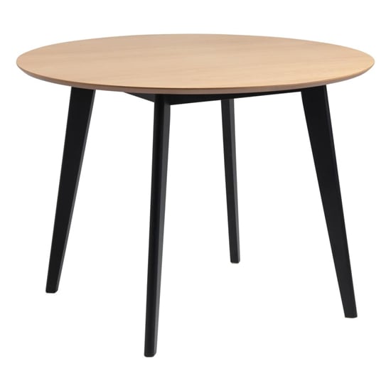 Read more about Reims wooden dining table round in oak with black legs