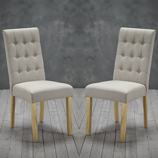 Read more about Remo beige fabric dining chairs with wooden legs in pair