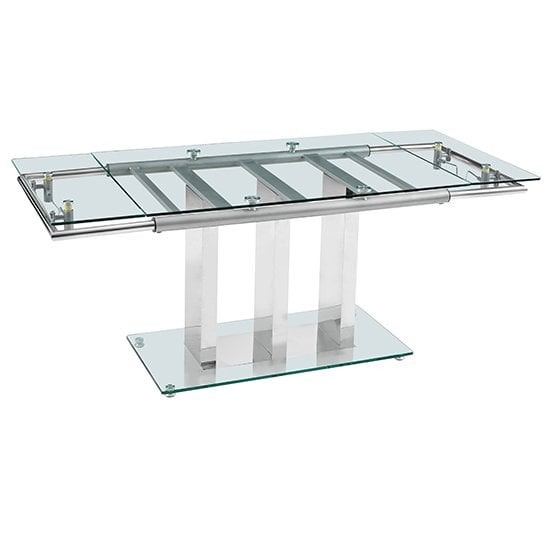 Photo of Rihanna extending clear glass dining table with chrome supports