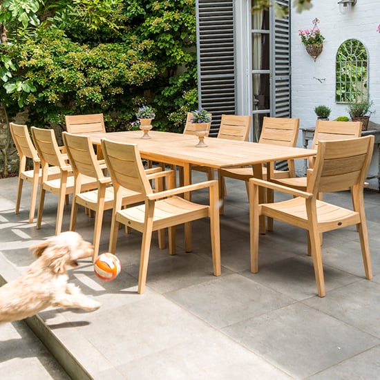 Photo of Robalt extending dining table with 10 stacking chair in natural