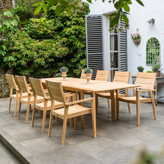 Photo of Robalt extending dining table with 8 stacking chair in natural