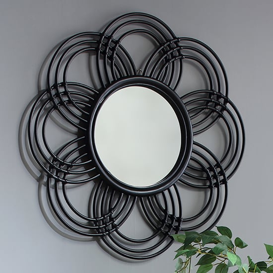 Photo of Santol sunflower wall mirror in black rattan frame