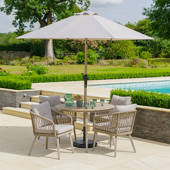 Photo of Seras round 4 seater dining set with 2.7m parasol in sand