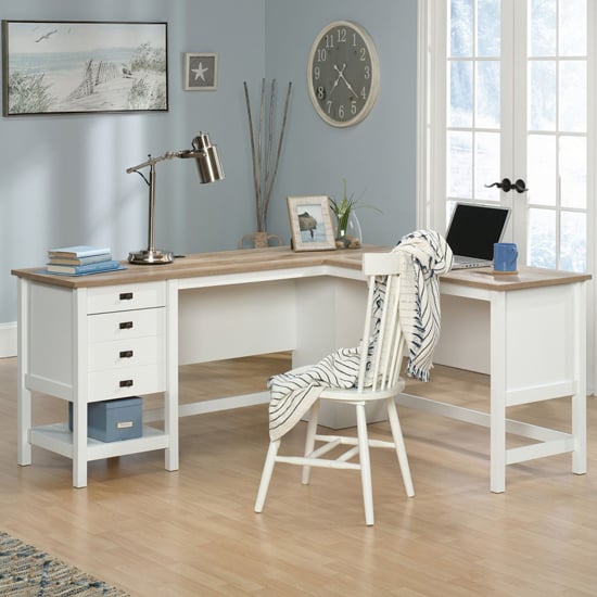 Photo of Shaker style wooden l-shaped computer desk in soft white