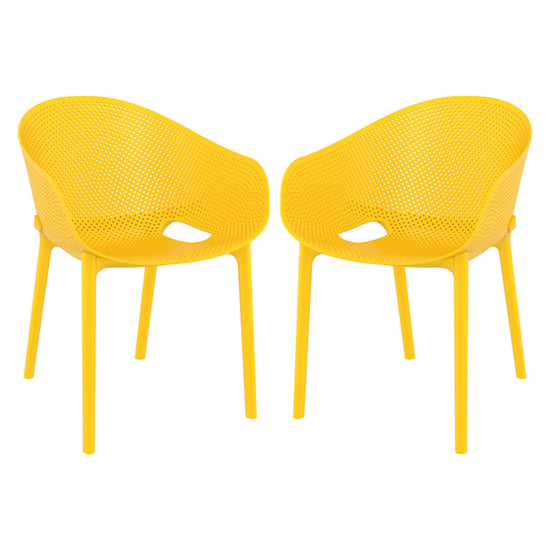 Photo of Shipley outdoor yellow stacking armchairs in pair