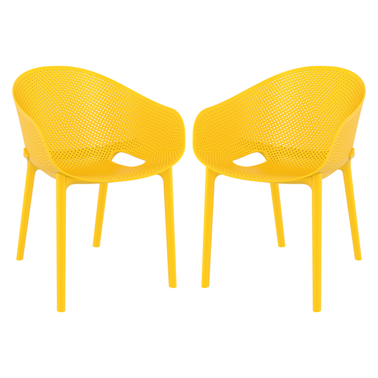 Photo of Shipley outdoor yellow stacking armchairs in pair