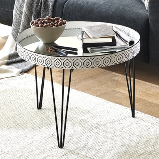 Photo of Sioux round mirrored coffee table in white with black legs