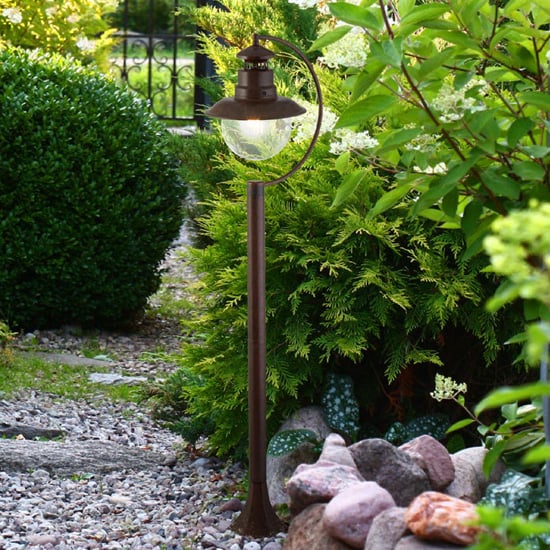 Photo of Station outdoor clear acrylic tall post light in rustic brown