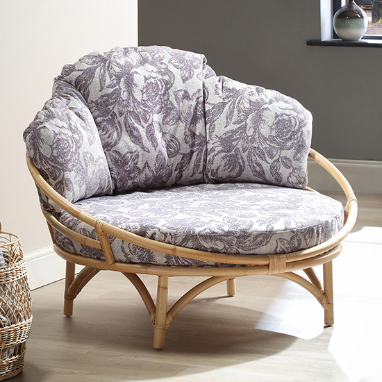 Photo of Surgut rattan snug chair in natural with floral lilac cushion
