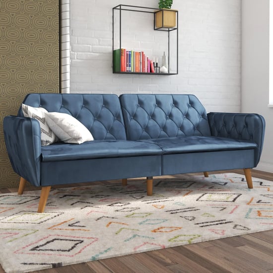 Photo of Taluka memory foam velvet sofa bed with wooden legs in blue