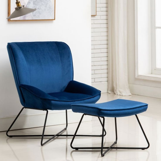 Photo of Teagan velvet upholstered accent chair in blue with footstool