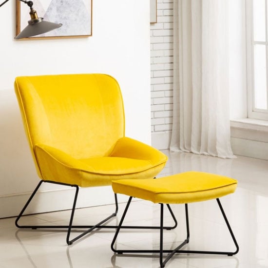 Photo of Teagan velvet upholstered accent chair in ochre with footstool