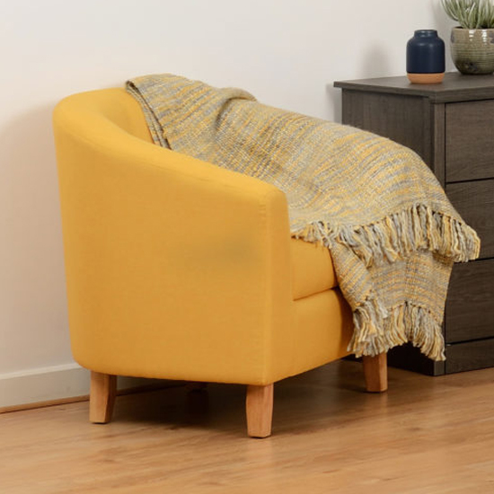 Photo of Trinkal fabric upholstered tub chair in mustard