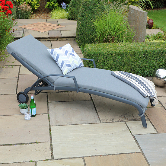 Product photograph of Thirsk Outdoor Cushioned Sun Lounger In Graphite Grey from Furniture in Fashion