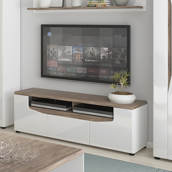 Photo of Toltec wide wooden tv stand in oak and white high gloss