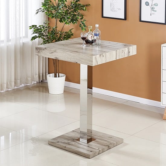 Photo of Topaz square wooden bar table in grey oak effect