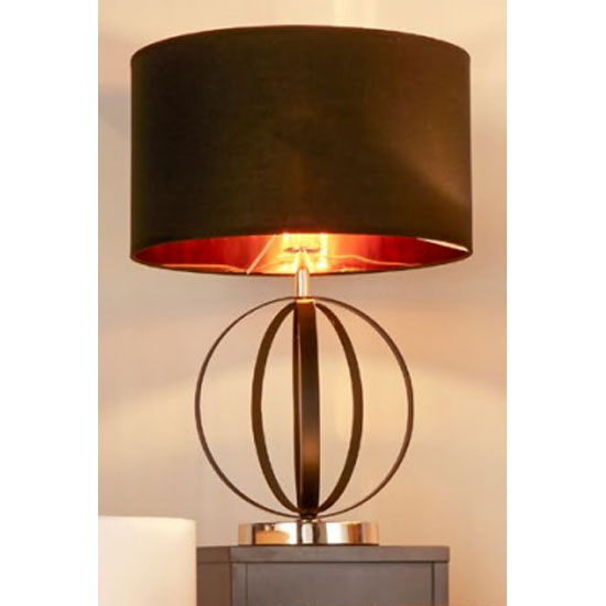 Photo of Unique black and gold table lamp with black shade gold inner