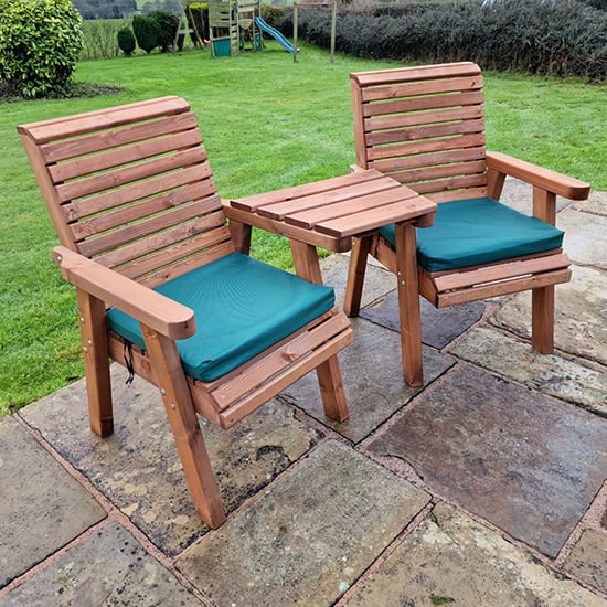 Photo of Vail timber angled love seat with green cushions