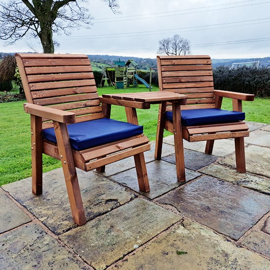 Photo of Vail timber angled love seat with navy cushions