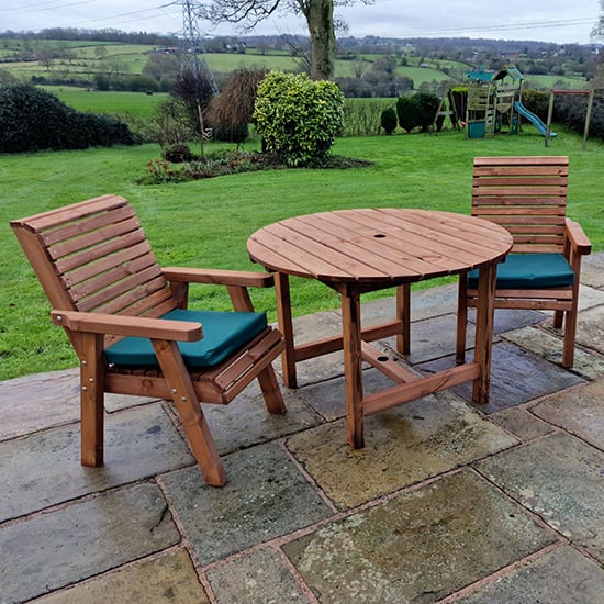 Photo of Vail timber brown dining table round with 2 chairs and cushion