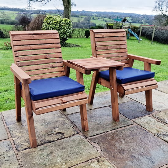 Photo of Vail timber square love seat with navy cushions