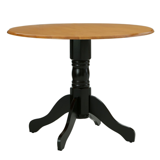 Photo of Varmora round wooden dining table in oak and black