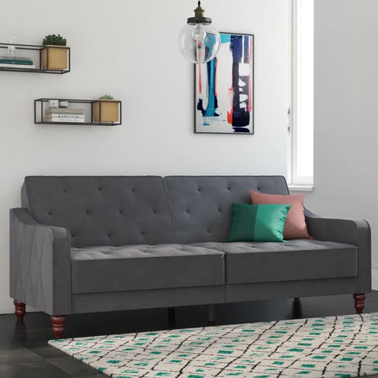 Photo of Vincenzo tufted futon velvet sofa bed with wooden legs in grey