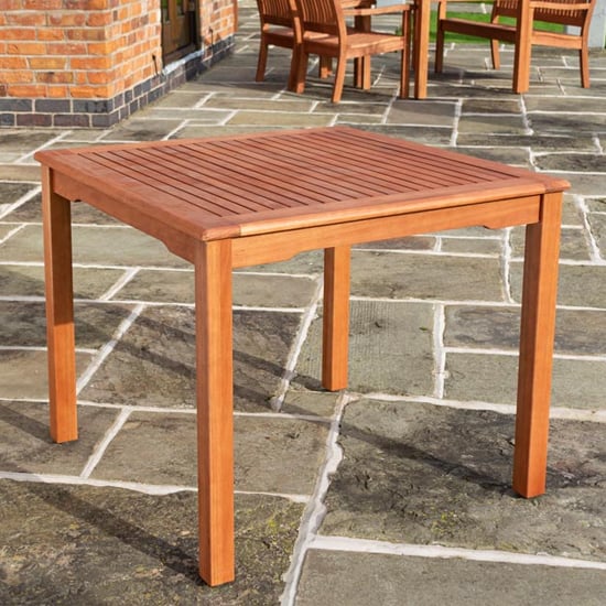 Photo of Walsall square wooden dining table in factory stain