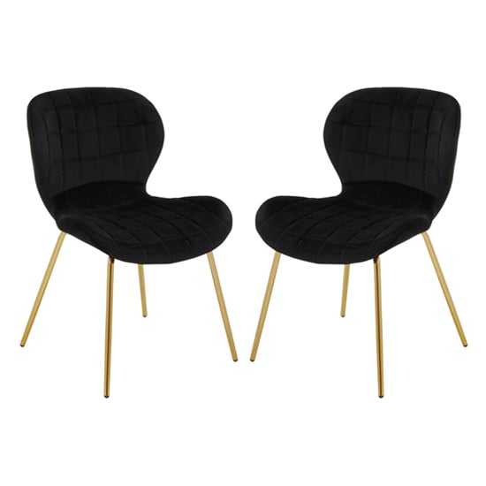 Photo of Warden black velvet dining chairs with gold legs in a pair