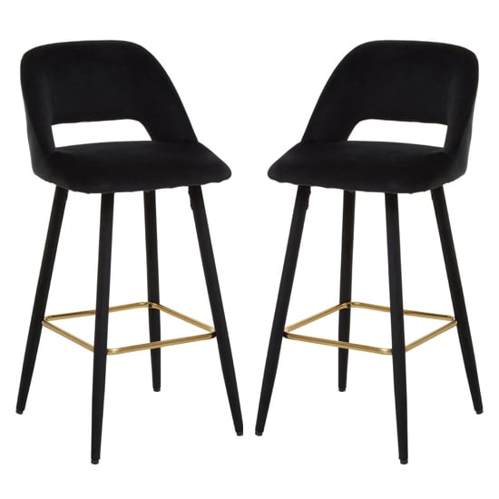 Read more about Warns black velvet bar chairs with gold footrest in a pair