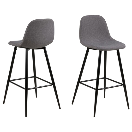 Read more about Woodburn light grey fabric bar stools with black legs in pair