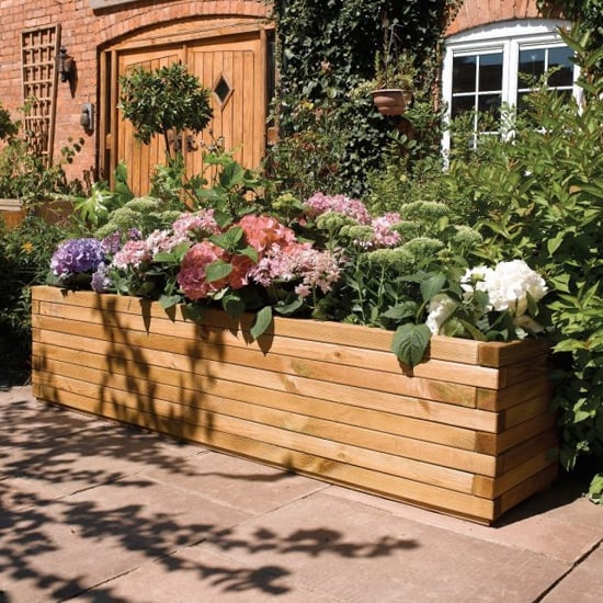 Photo of Wymondham wooden patio planter in natural timber