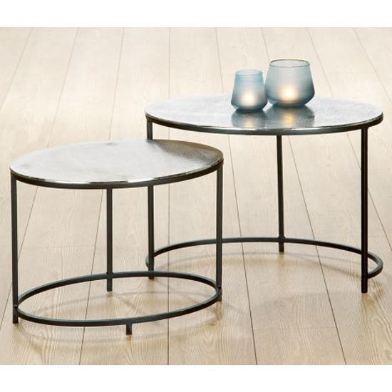 Read more about Yreka oval set of 2 nesting tables in silver with metal frame