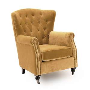 Reedy Velvet Wingback Chair In Mustard With Metal Castor